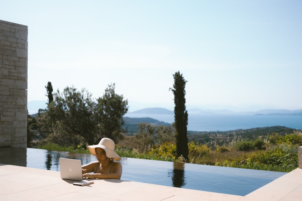 Working from an infinity pool overlooking the Mediterranean
