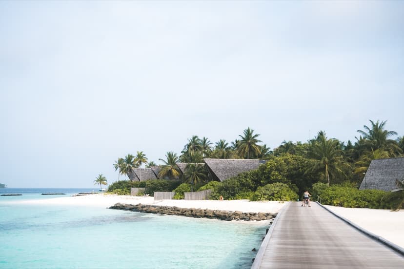 Maldives resort boardwalk over turquoise water